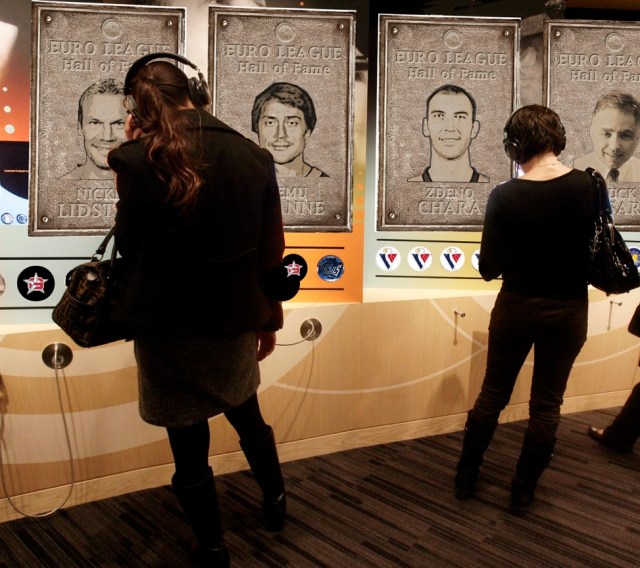 Visitors listen to recorded audio about the inductees.